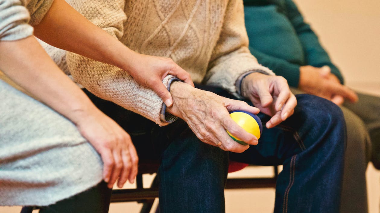 Free Person Holding a Stress Ball Stock Photo